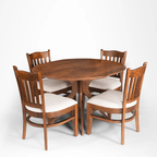 Oval shape Solid wood dining with 4 chairs.